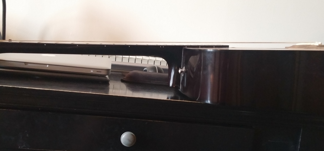 Acoustic guitar with high string action