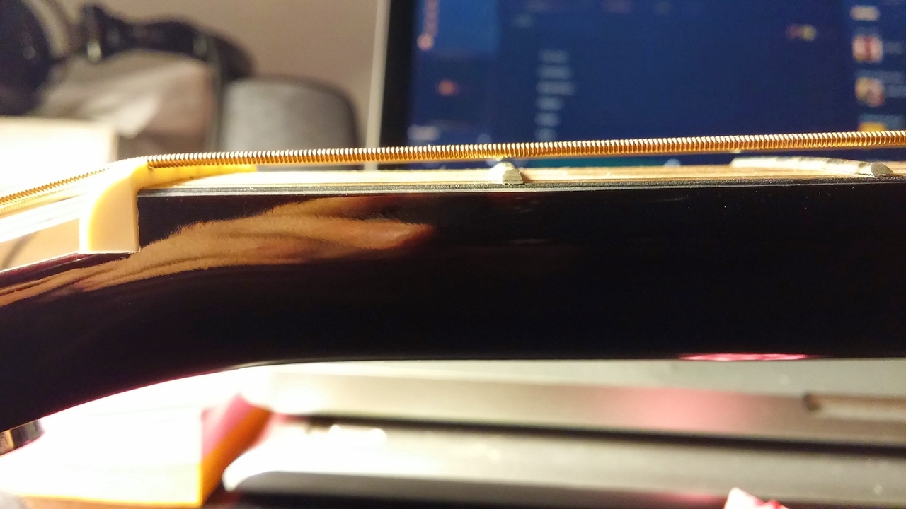 Truss rod adjustment process with allen wrench