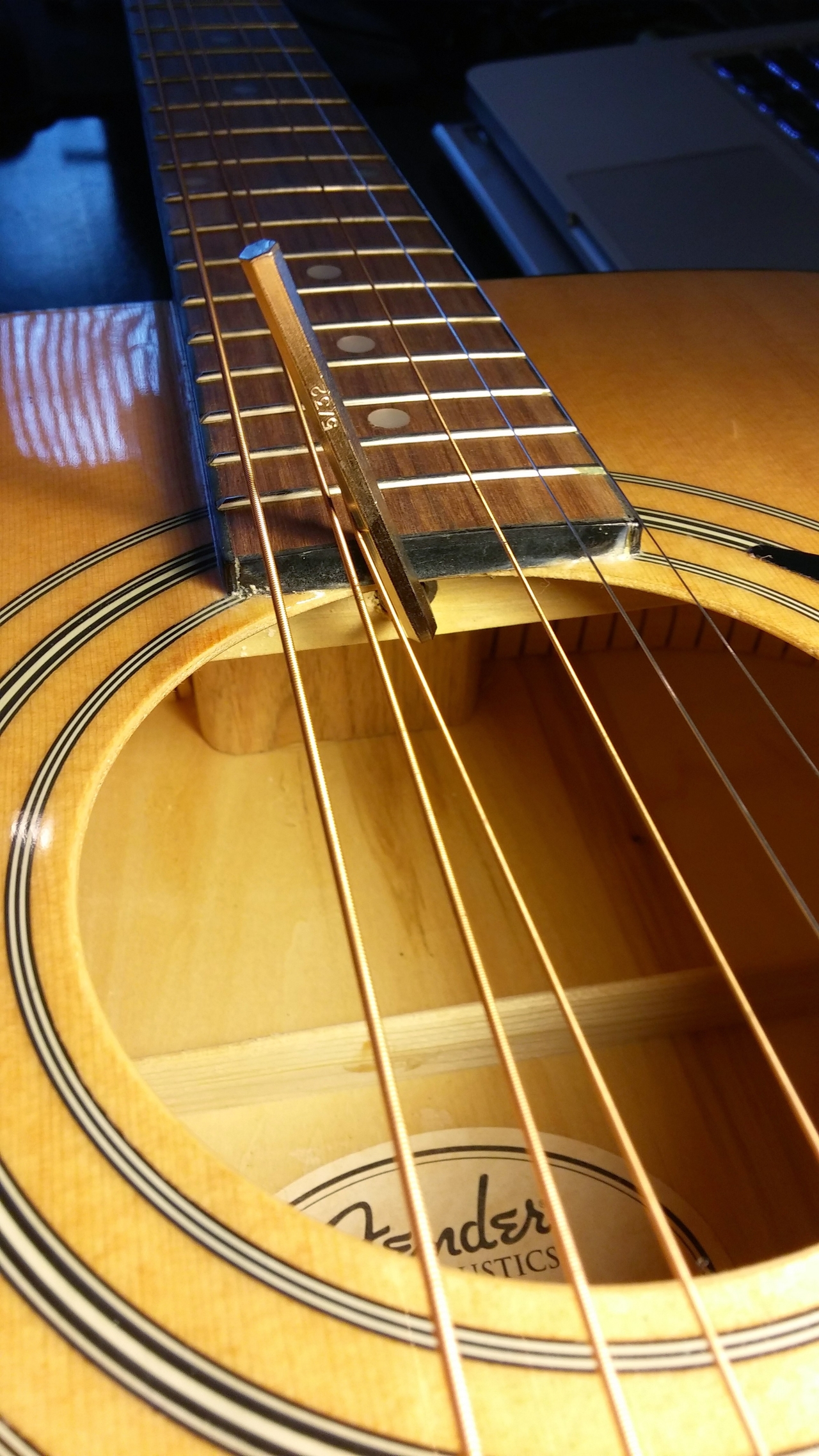 Truss rod adjustment process with allen wrench
